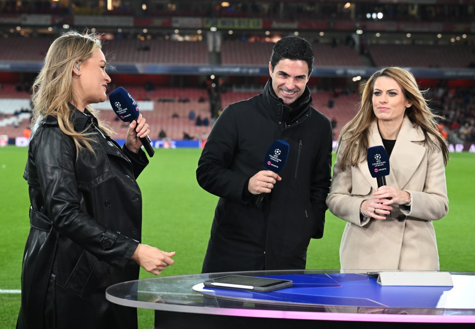 Mikel Arteta with two sports reporters at a Champions League match.