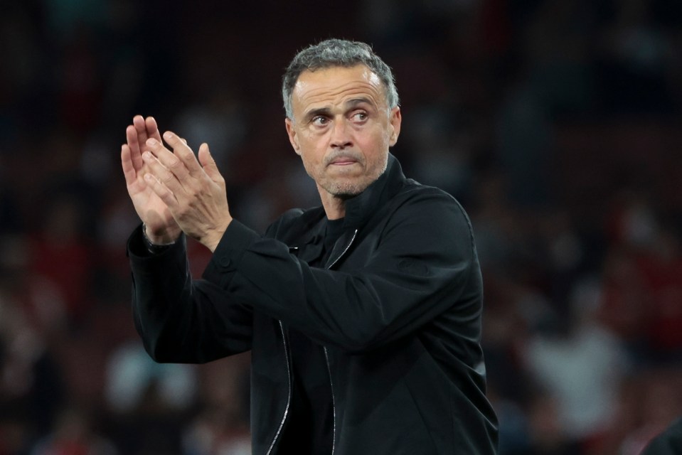 Luis Enrique applauding after a soccer match.