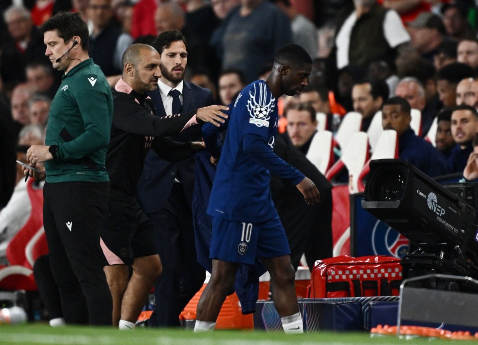 Ousmane Dembele being substituted during a soccer match.