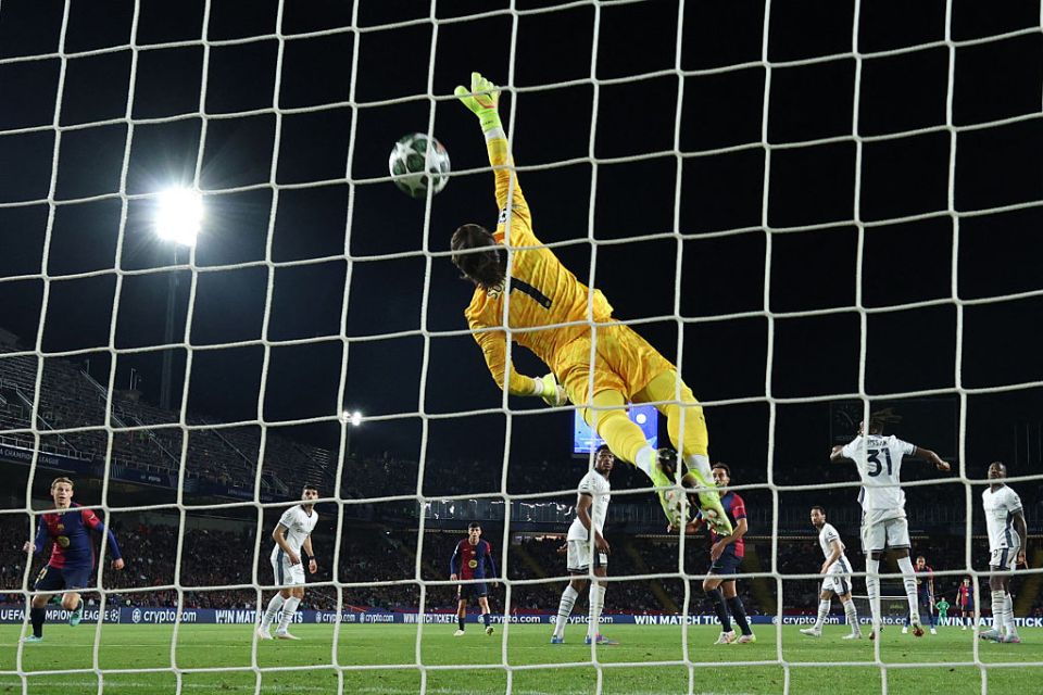 Inter Milan's Swiss goalkeeper #01 Yann Sommer scores an own goal during the UEFA Champions League semi final first leg football match between FC Barcelona and Inter Milan at the Estadi Olimpic Lluis Companys in Barcelona on April 30, 2025. (Photo by LLUIS GENE / AFP) (Photo by LLUIS GENE/AFP via Getty Images)