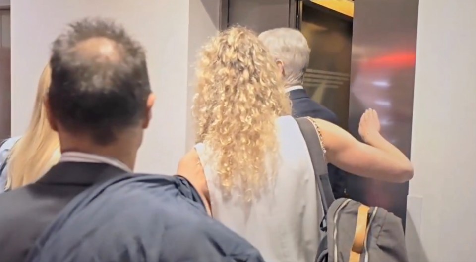 People entering an elevator.
