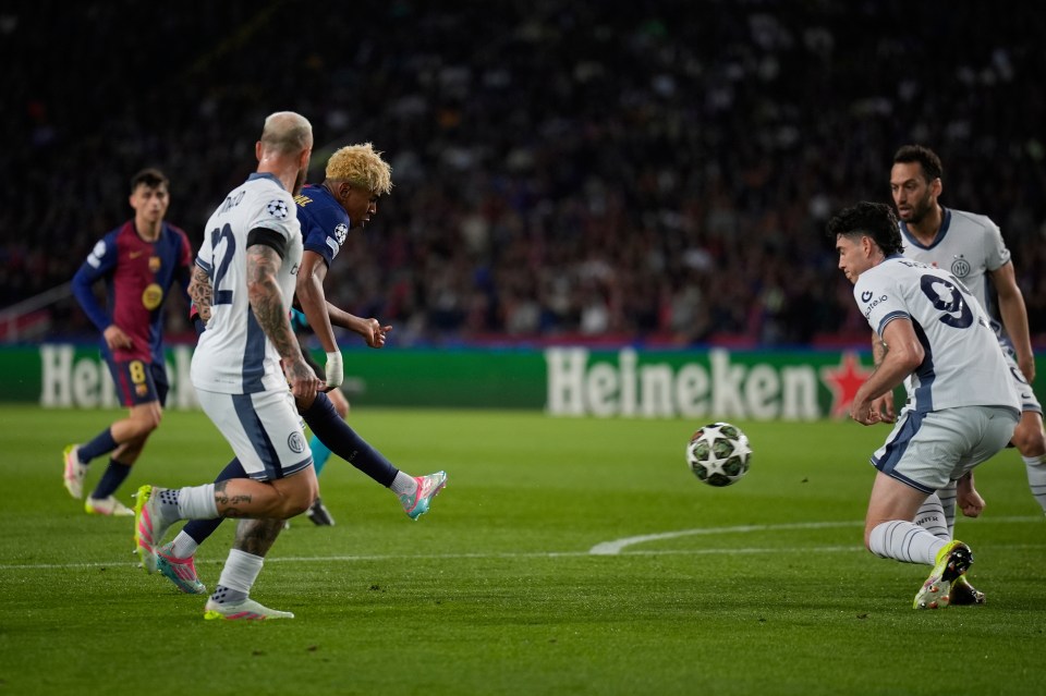 Barcelona's Lamine Yamal scoring during a Champions League match.