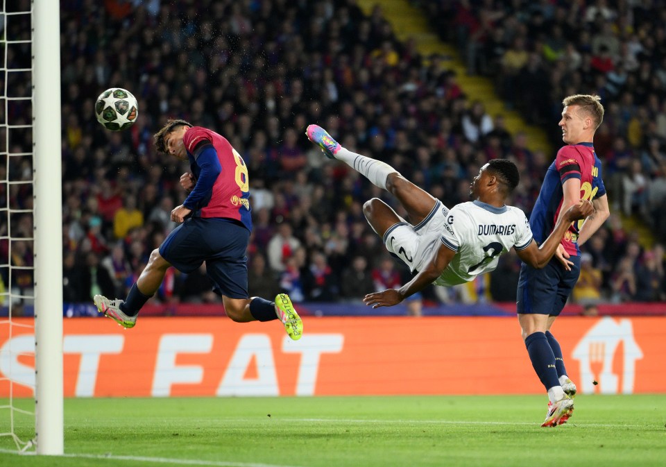 Denzel Dumfries of FC Internazionale scoring a goal during a UEFA Champions League match.