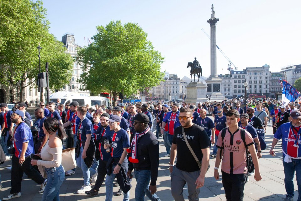 Paris Saint-Germain fans walking in Trafalgar Square before a Champions League match.