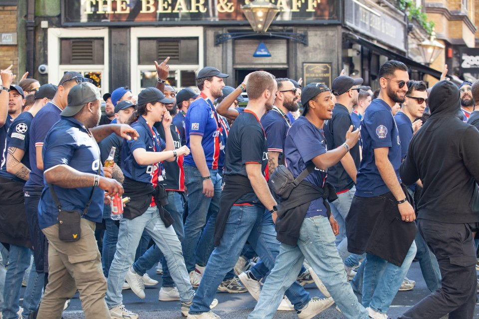 Paris Saint-Germain fans walking in Trafalgar Square.