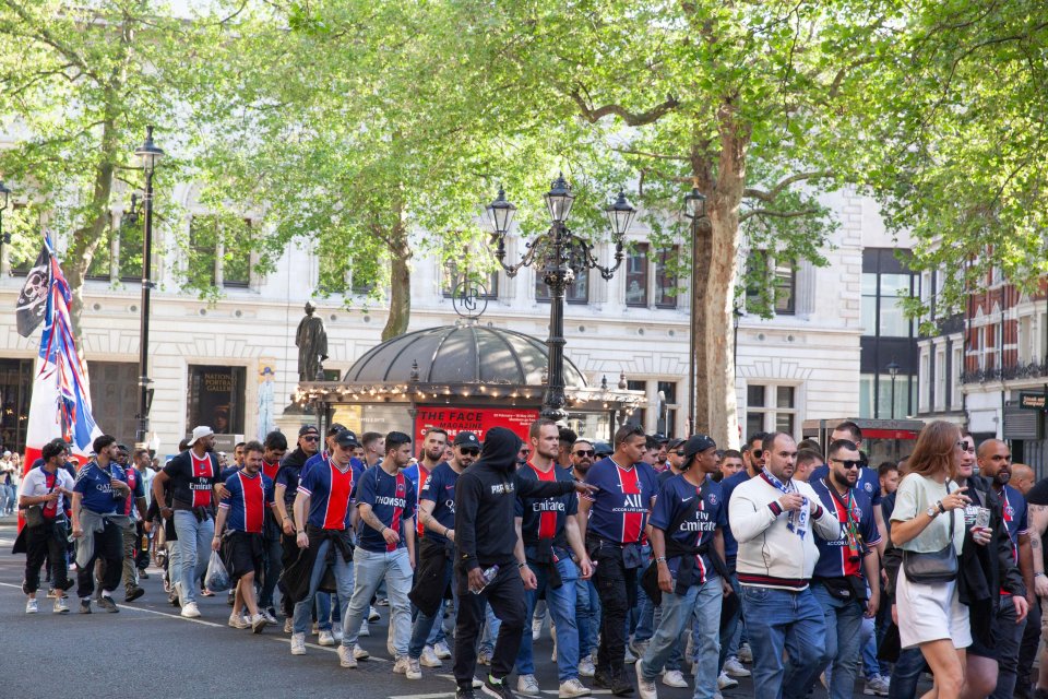Paris Saint-Germain fans walking in Trafalgar Square.