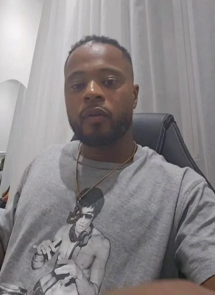 Patrice Evra in a grey t-shirt.