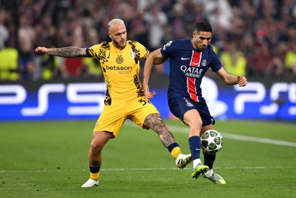 MUNICH, GERMANY - MAY 31: Achraf Hakimi of Paris Saint-Germain is fouled by Federico Dimarco of FC Internazionale during the UEFA Champions League Final 2025 between Paris Saint-Germain and FC Internazionale Milano at Munich Football Arena on May 31, 2025 in Munich, Germany. (Photo by Stu Forster/Getty Images)