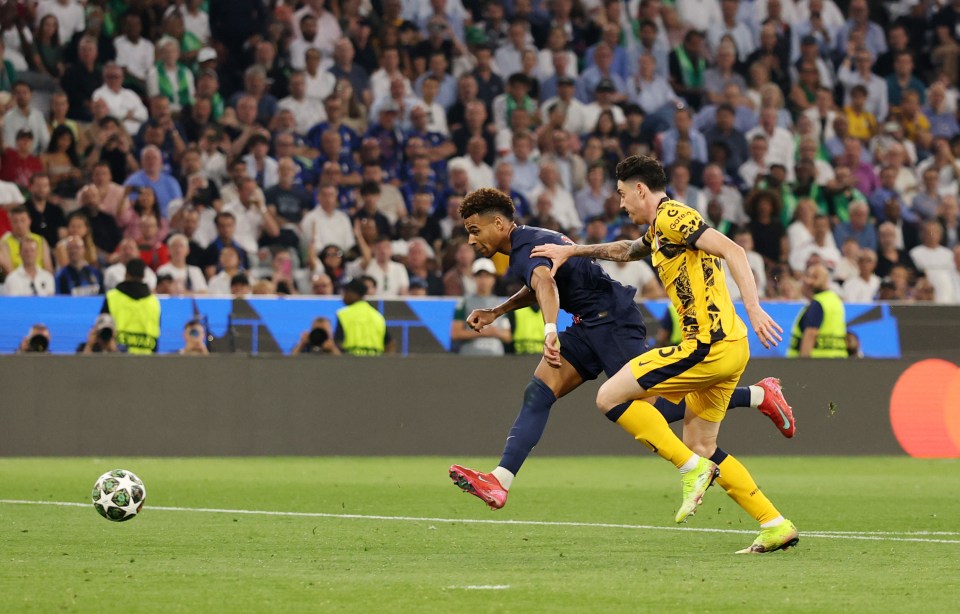 Soccer player Desire Doue of Paris Saint-Germain scoring a goal.