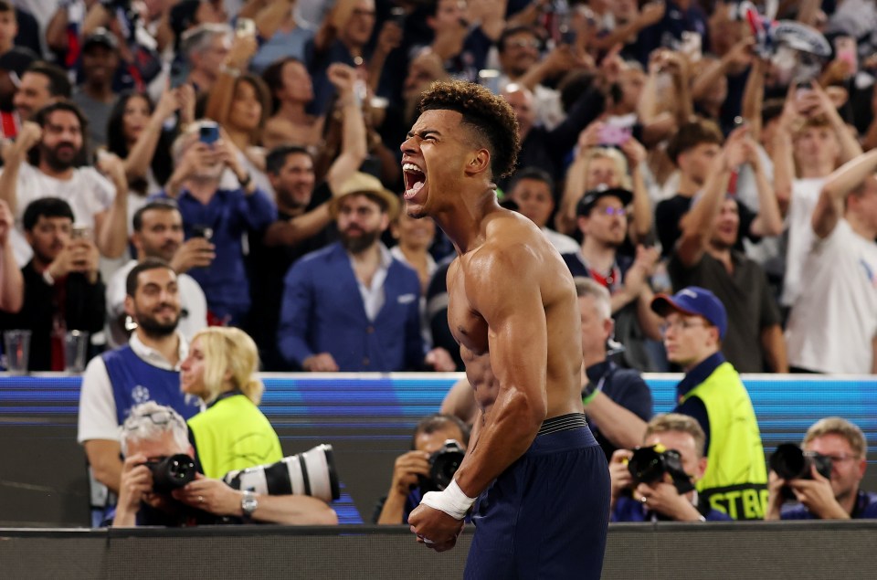 Desire Doue of Paris Saint-Germain celebrates scoring a goal.