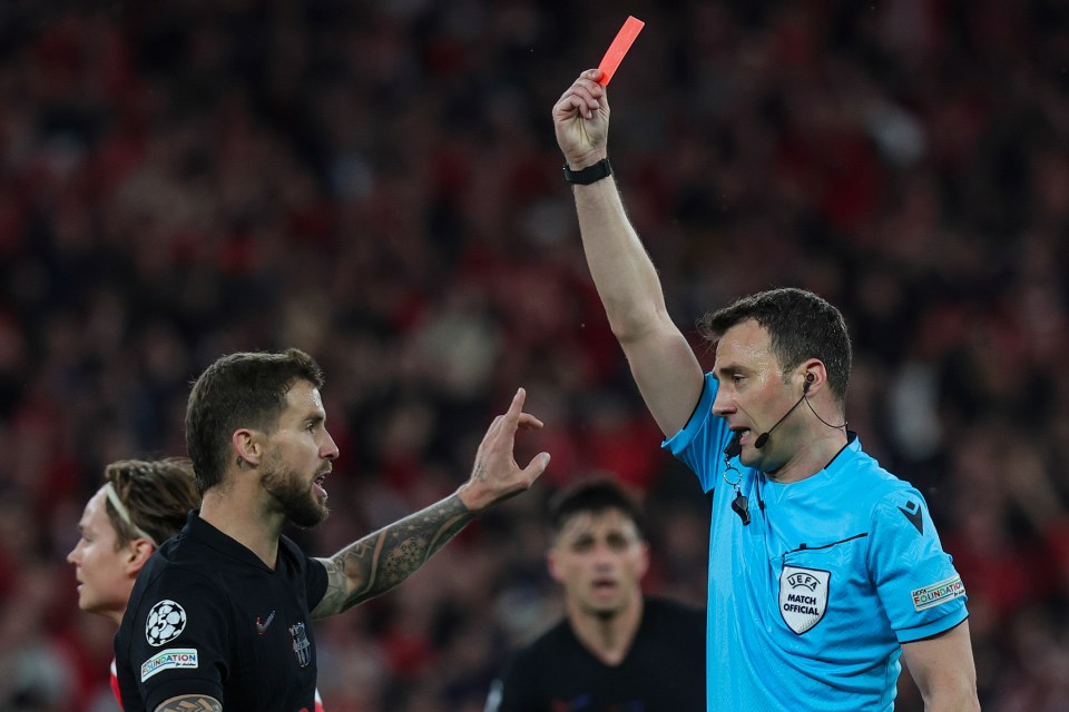 Referee showing a red card.