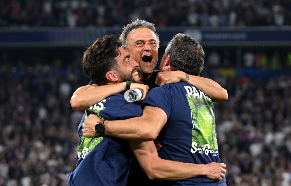 Luis Enrique, Paris Saint-Germain's head coach, celebrating with his coaching staff.