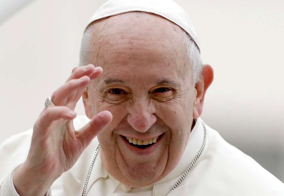 Pope Francis waving.